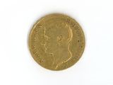 a gold coin with a picture of a woman on it