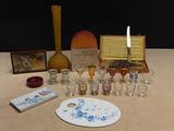 a table with a lot of glassware and a painting board