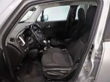 the interior of a car with the door open and the driver ' s seat down