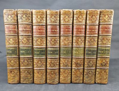 a set of seven books with gold covers and ornate designs