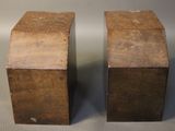 two pieces of wood sitting next to each other on a table