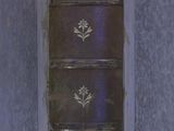 an old book that is sitting on a table