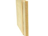 two pieces of wood are stacked on top of each other