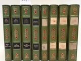 six green books are lined up in a row on a white surface