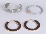 three pairs of hoop earrings and a bracelet