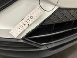 a ruler on the front of a car that is parked in a garage