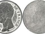 a close up of a coin with a woman ' s face on it