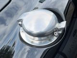 a close up of a car ' s door handle with a mirror on it