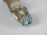a close up of a piece of metal on a white surface