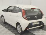 two small cars parked in a room with a checkered floor