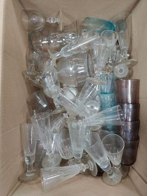 a box full of empty glasses and cups in it