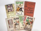 several books are stacked on top of each other on a table