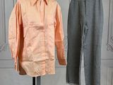 two shirts and pants on a mannequin stand