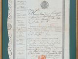 un vieux document portant un sceau rouge, encadré d'or