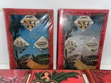 several books are sitting on a table with a red cover