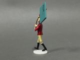a small figurine of a man holding a sign