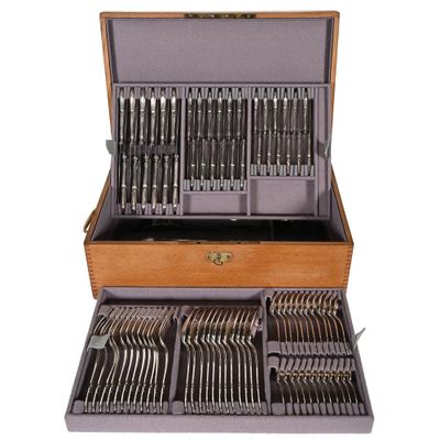 a wooden case with silverware in it on a white background