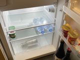 an open refrigerator with a lot of food inside of it