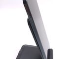 a cell phone that is sitting on top of a stand