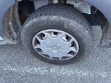 a close up of a car ' s tire on the street