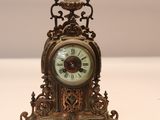 a small clock that is sitting on a table