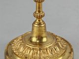 a gold cup that is sitting on top of a table