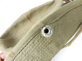 a person holding a bag with a hole in it