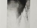 an image of a black and white photo of a man standing in the water