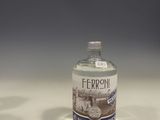 a small bottle of water sitting on a table