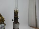 a lamp that is sitting next to a vase on a table