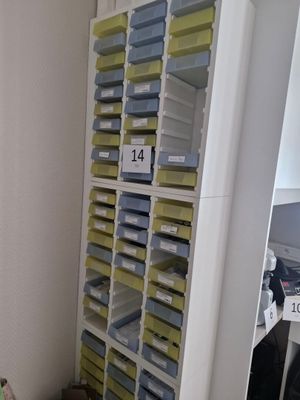 many bins and boxes on the shelves in the room
