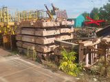 a pile of wood sitting on the side of the road