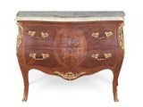 an antique chest of drawers with a marble top