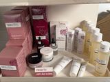many different types of skin care products displayed on a shelf