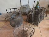 three baskets with wine bottles in them sitting on a tiled floor