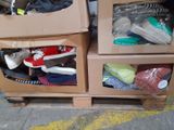 two boxes with shoes in them sitting on a pallet
