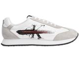 a white and grey sneaker with a design on the side