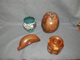 three pieces of wood that are on a table