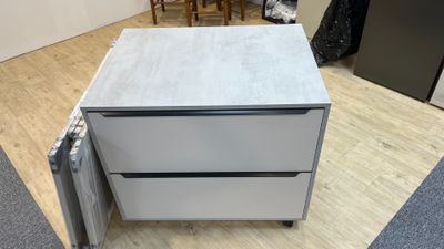 two drawers that are sitting on the floor next to each other