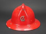 a red fireman ' s helmet with a peace sign on it
