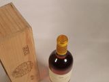 a bottle of wine sitting next to a wooden box