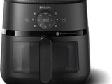 a close up of a black air fryer on a white background