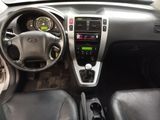 a dashboard of a car with a steering wheel and dashboard controls