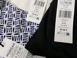 the shirt is white and blue with a pattern on it