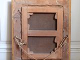 a picture of an old wooden frame with a rope around it