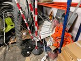a pile of assorted items on the floor in a garage