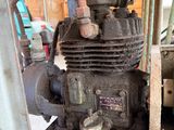 an old engine that is sitting in the garage