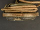 a close up of a metal object with a rope attached to it