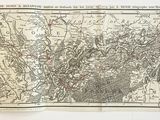 une vieille carte de la ville de Paris sur laquelle figure un point rouge