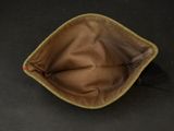 a brown bag with a black brush inside of it
